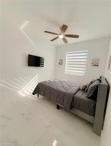 Bedroom featuring a ceiling fan
