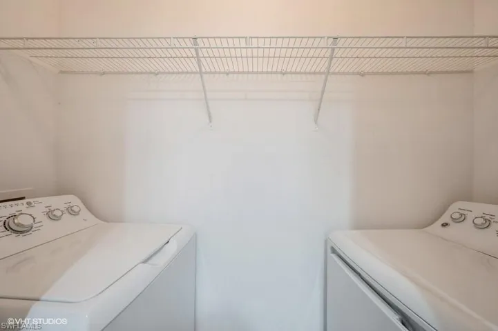 Laundry room featuring separate washer and dryer