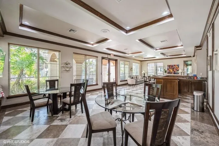 Clubhouse featuring crown molding and coffered ceiling