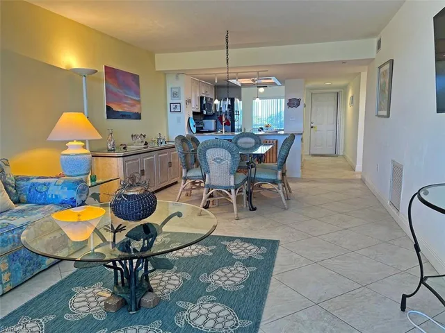 Dining room featuring light tile patterned floors and baseboards
