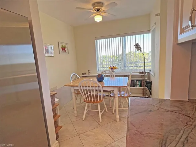 Dining room featuring ceiling fan and light tile patterned floors