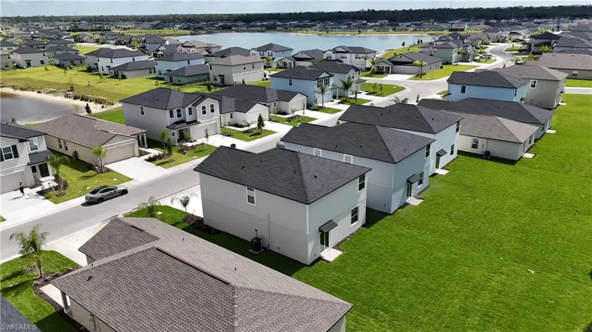 Aerial perspective showcasing a residential community with multiple single-family homes