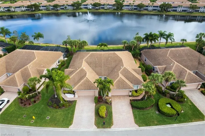 Aerial perspective of suburban area featuring a large body of water