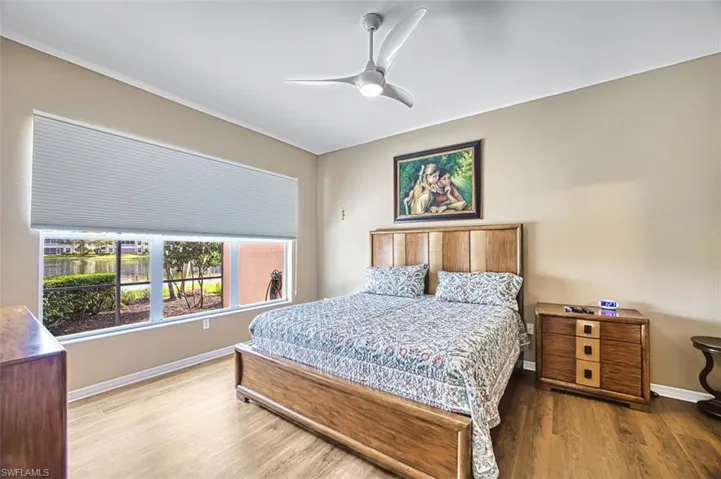 Bedroom with wood finished floors and a ceiling fan