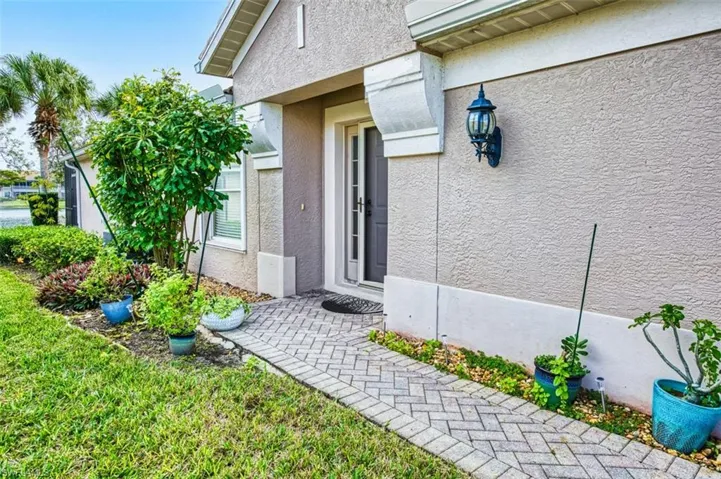 Property entrance with stucco siding