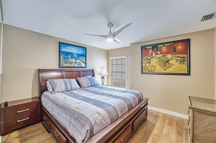 Bedroom with light wood finished floors and ceiling fan
