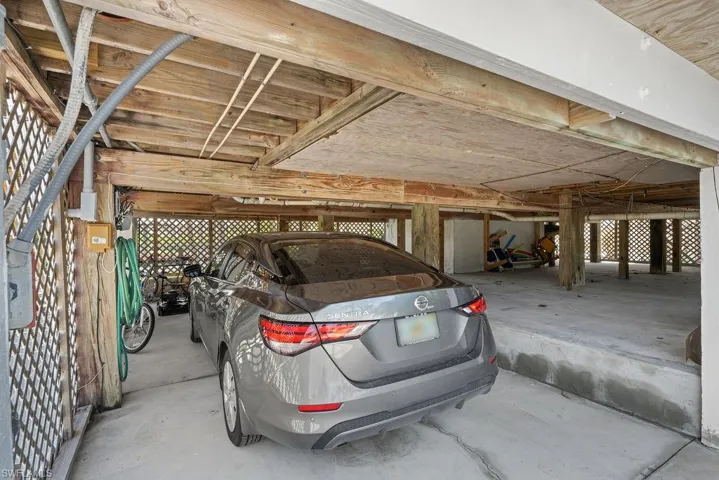 Storage area below house will fit a car