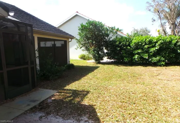 View of yard featuring a sunroom
