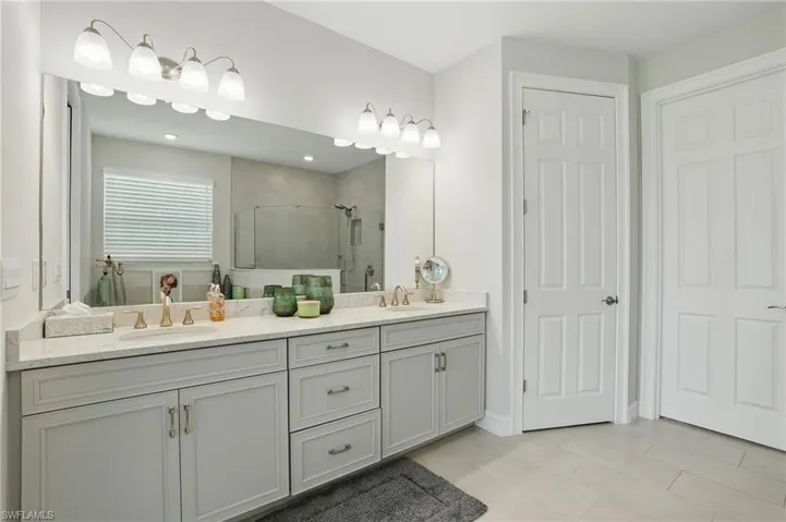 Full bath featuring vanity and shower / bath combination with curtain