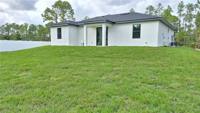 Back of house with stucco siding