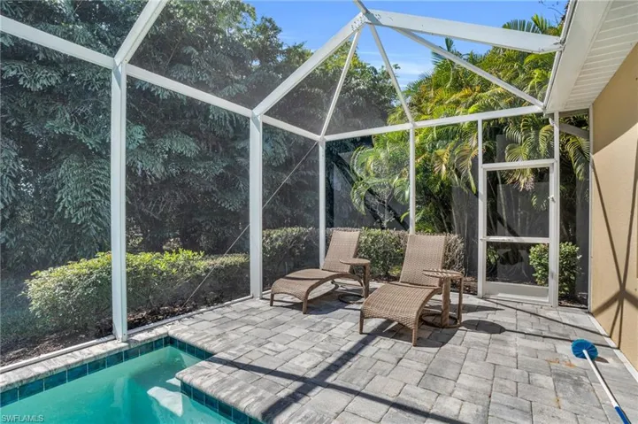View of pool featuring a patio area and a lanai
