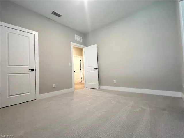 Spare room with wood tiled floors and a ceiling fan