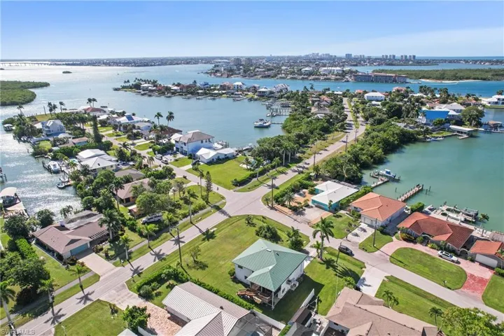 Aerial view of residential area featuring a large body of water