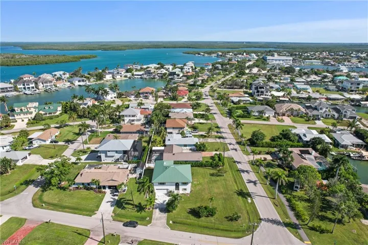 View of property location with nearby suburban area and a large body of water
