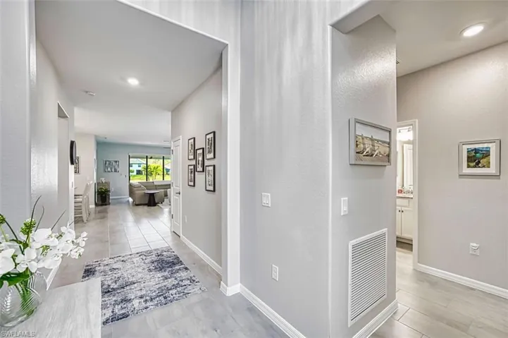 Foyer with 12x24" tiled flooring