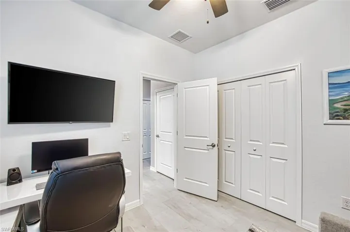 Bedroom #3 being used as a home office.  Just off the entry