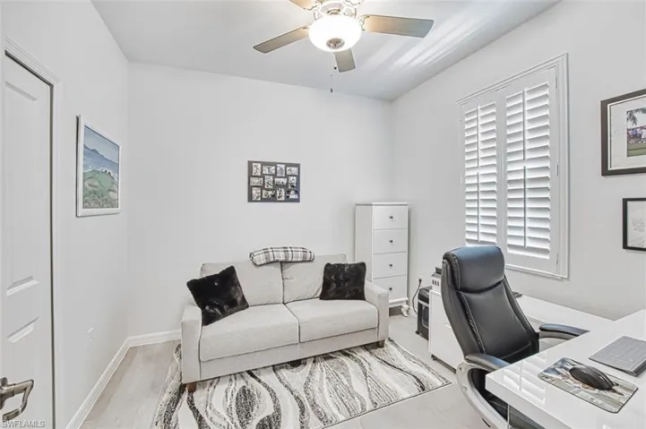 Bedroom #3 is being used as a home office with tile floors