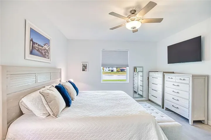 Primary Bedroom with a ceiling fan and tile floors
