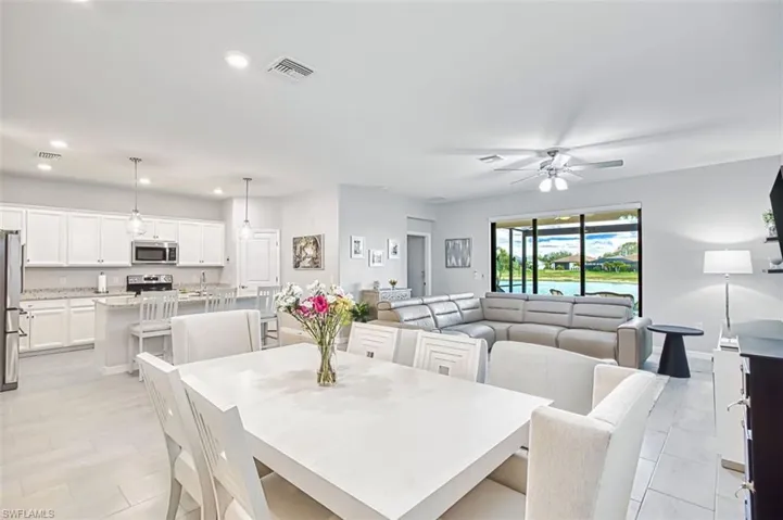 Dining area featuring ceiling fan and recessed lighting
