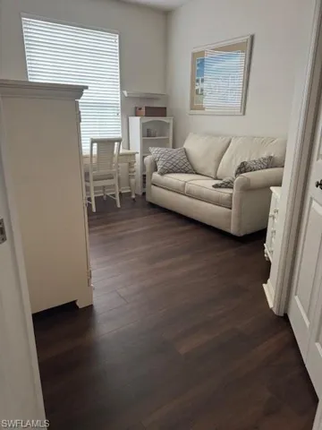 Living room featuring dark wood finished floors