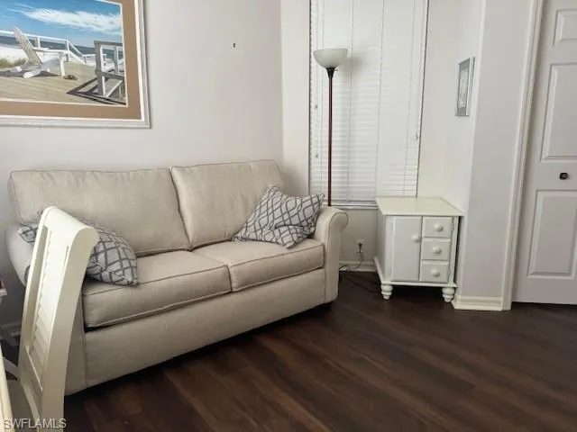 Living area featuring wood finished floors and baseboards