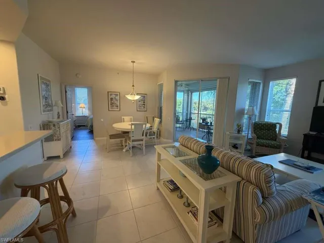 Living room featuring light tile patterned flooring