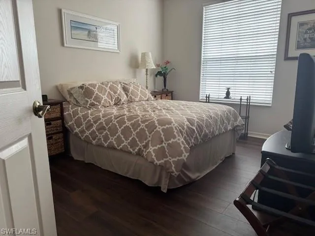 Bedroom featuring dark wood finished floors
