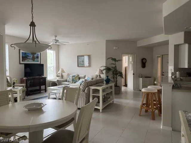 Dining room with ceiling fan and light tile patterned floors
