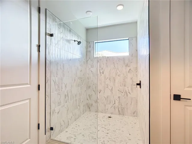 Bathroom featuring walk in shower