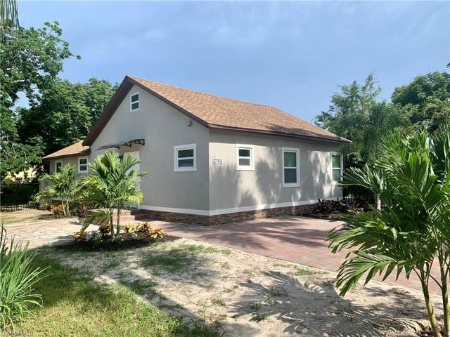 Wider view of paved driveway off Matheson and paved walkway leading to entry door off Cherry