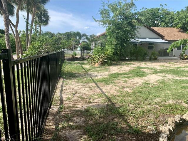 Looking across remaining lot toward house