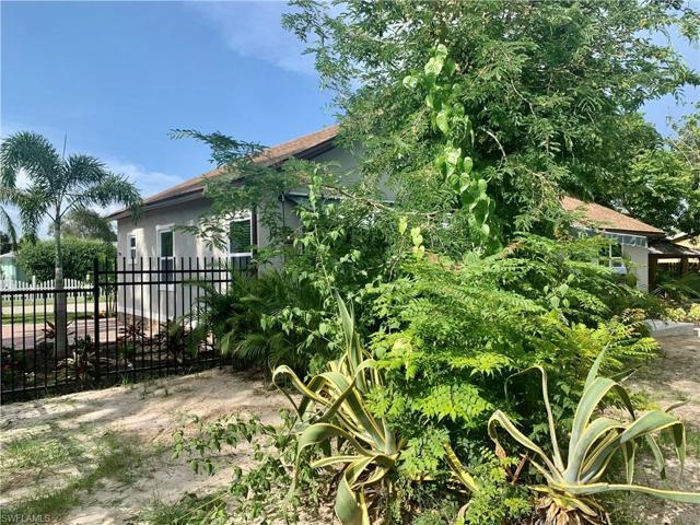 Side yard view toward Matheson, fence and side of house