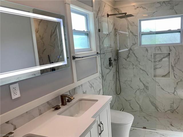 Two windows in bathroom