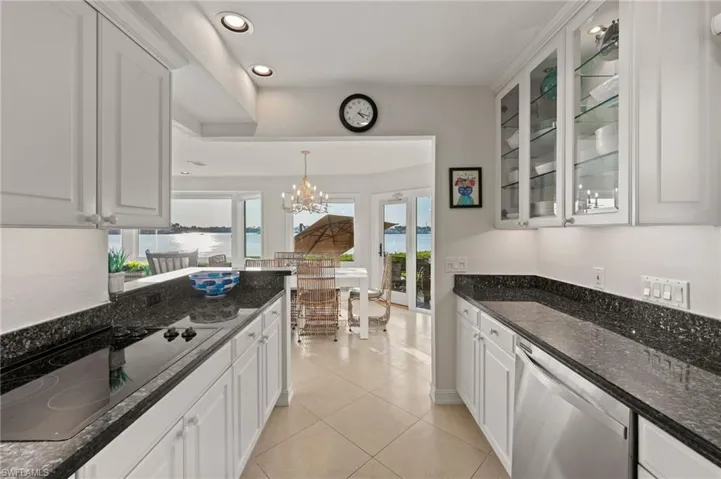 Kitchen featuring dishwasher and white cabinets
