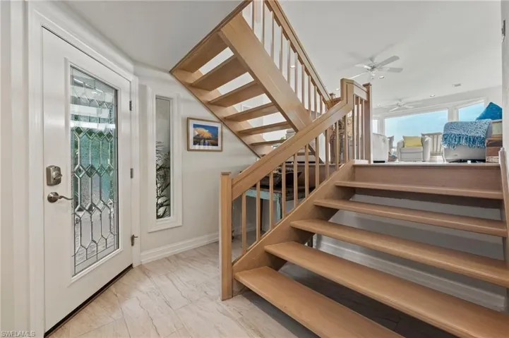 Foyer featuring ceiling fan