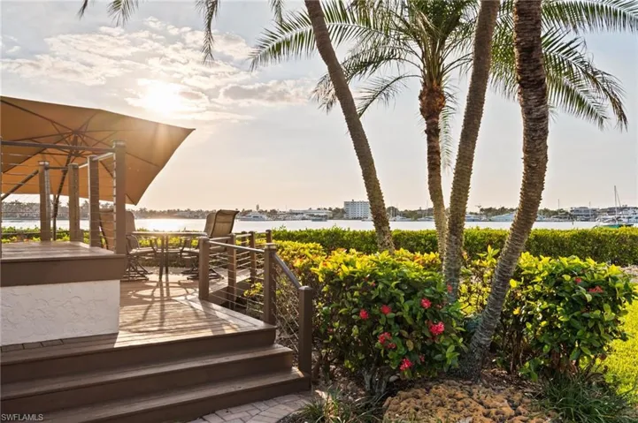 Wooden terrace featuring a water view