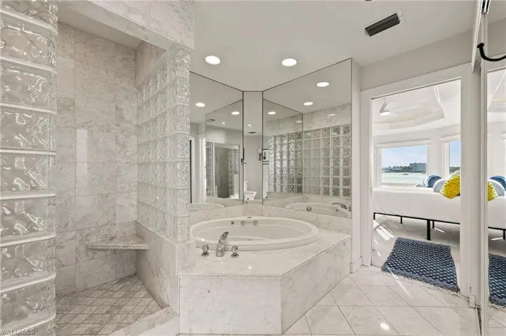 Bathroom featuring independent shower and bath