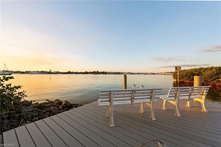Dock area featuring a water view