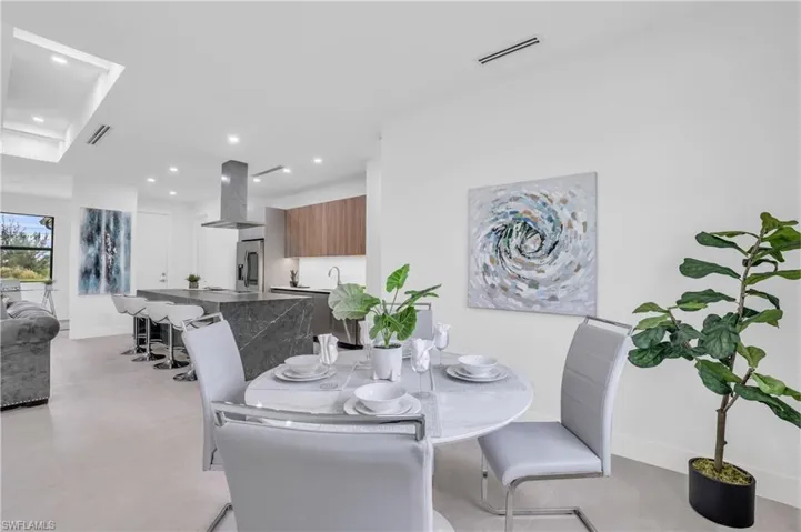 Dining space featuring light tile patterned flooring