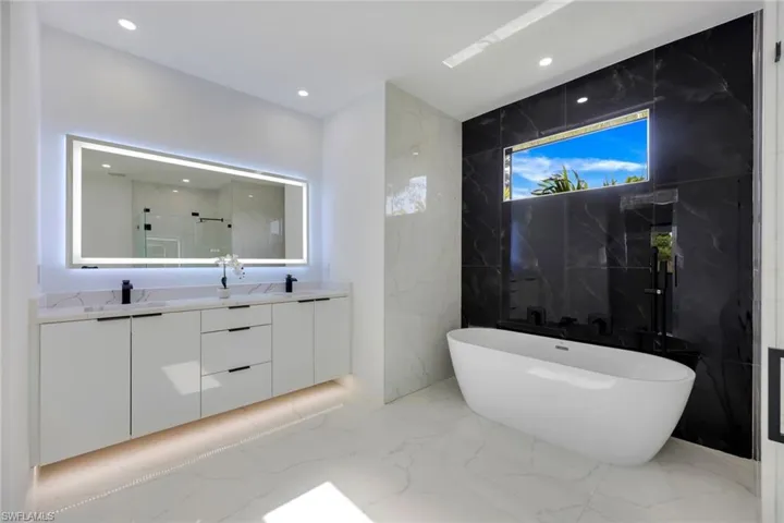 Bathroom with plus walk in shower and vanity