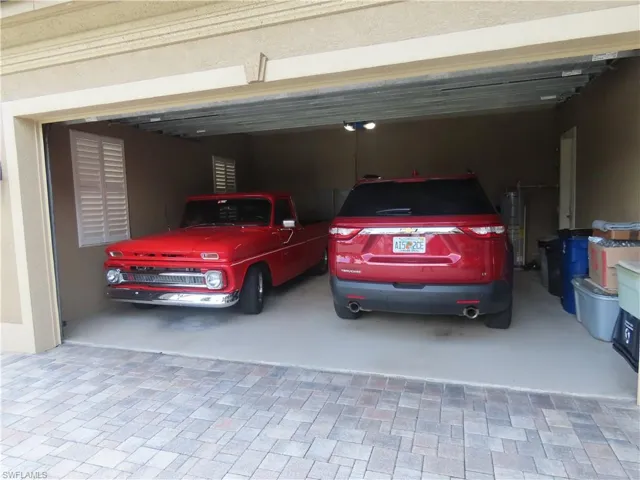 Two car Garage side which includes the water heater and 400-amp electric service boxes.