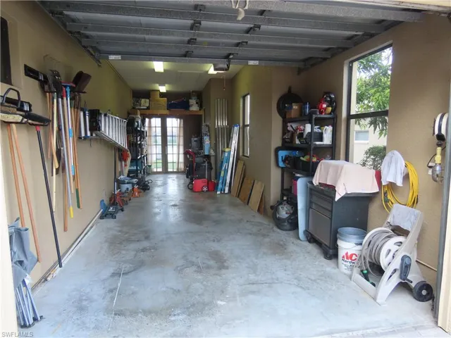 3rd car Garage spot that is 33' deep, room for a boat, car and golf cart, workshop area, or storage area.