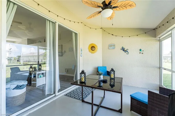 Sunroom / solarium featuring a wealth of natural light and ceiling fan