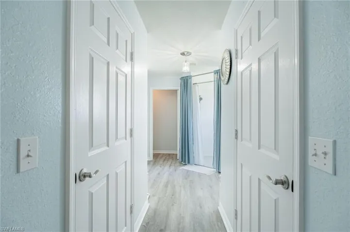 Hallway featuring light hardwood / wood-style flooring