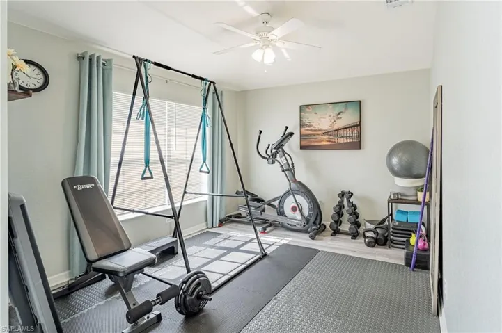 Exercise room featuring ceiling fan