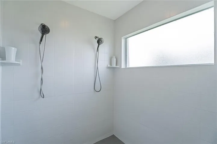 Bathroom featuring a tile shower