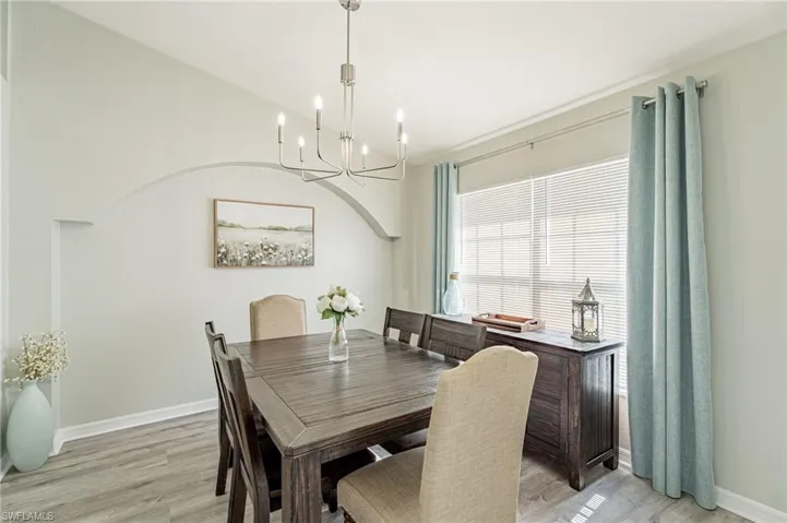 Dining space featuring a chandelier and light hardwood / wood-style floors