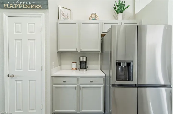 Kitchen featuring stainless steel fridge