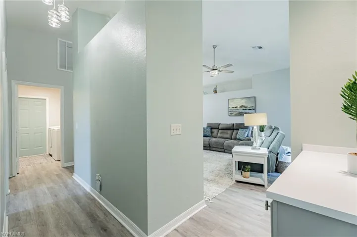 Hallway featuring light hardwood / wood-style flooring