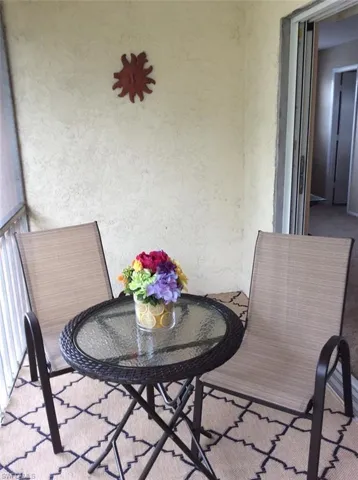 Screened lanai overlooking landscape area